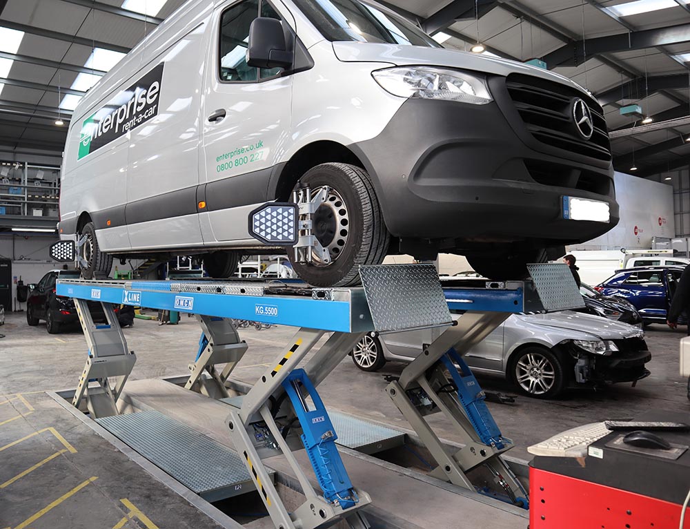 a van on an xlin lift installed by auto-tools for Fylde accident repair
