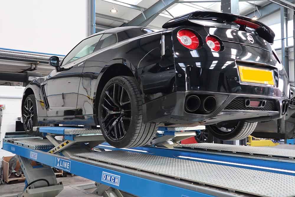 a car on an Xline OMCN lift installed by Autotools